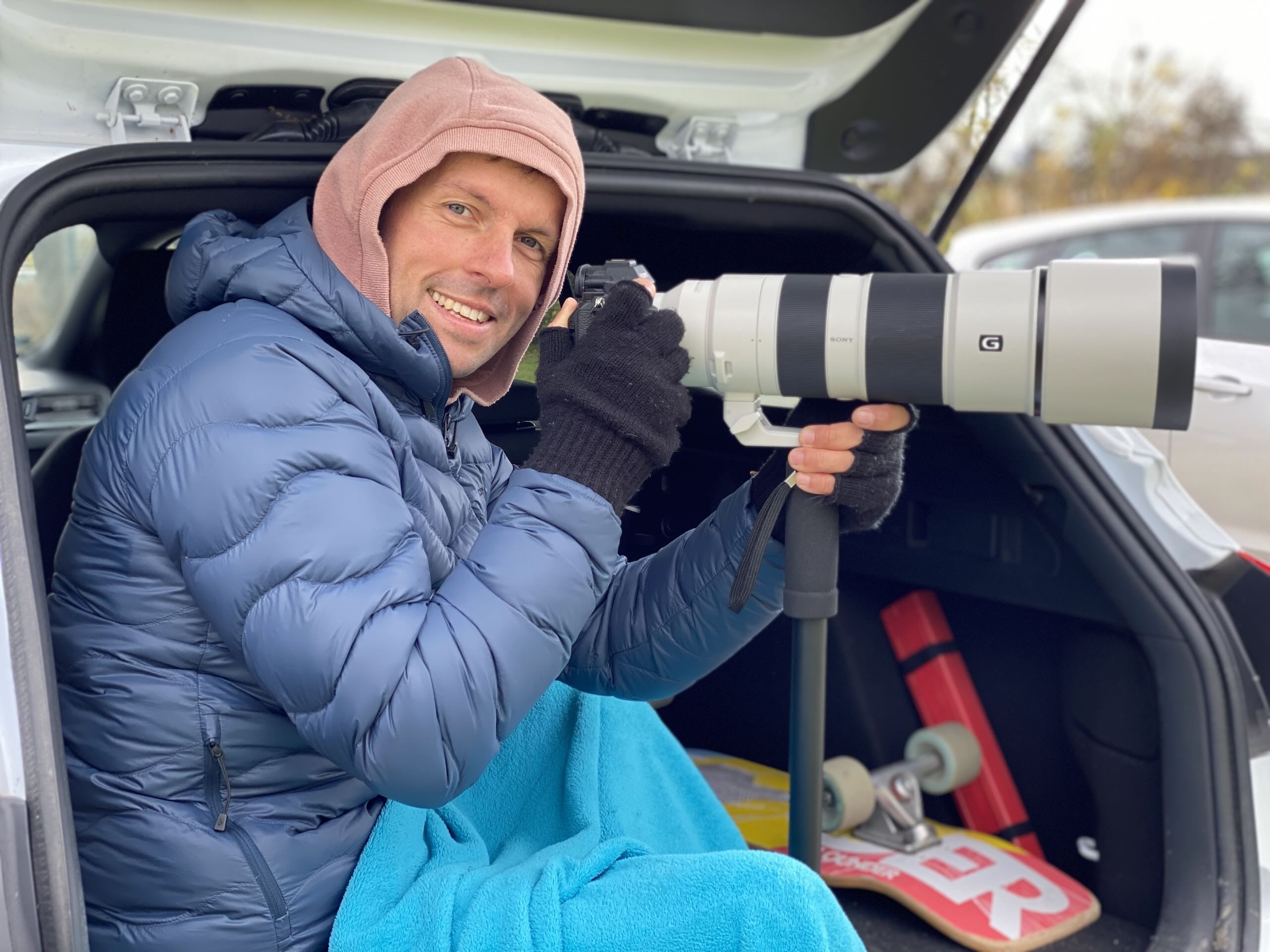 Piotr Piątek (Pedro Viernes) sitting inside his car trunk, while photographing a Krakow Dragoons FC match