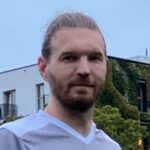 Boris Sidareika of Krakow Dragoons FC posing for a photo with a ball under his foot