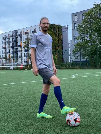 Boris Sidareika of Krakow Dragoons FC posing for a photo with a ball under his foot