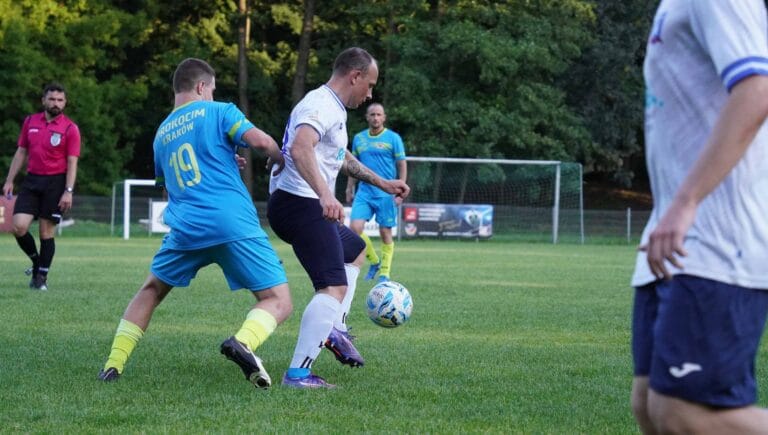 Serhii Yelysieiev of Krakow Dragoons FC controlling the ball with an opponent behind him
