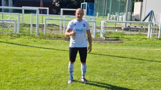Serhii Yelysieiev of Krakow Dragoons FC posing for a profile picture giving the thumbs up