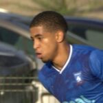 Taye Johnson of Krakow Dragoons FC carrying the ball forward in a match vs Galicja Raciborowice