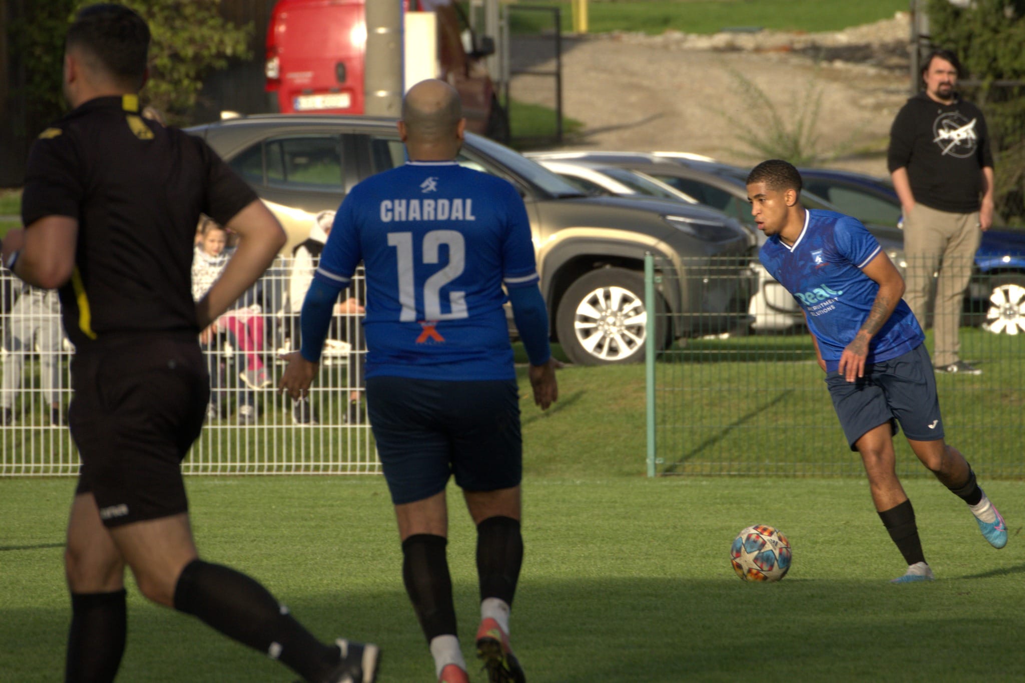 Taye Johnson of Krakow Dragoons FC carrying the ball forward in a match vs Galicja Raciborowice