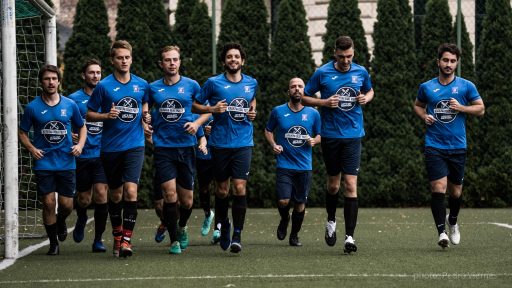 Krakow Dragoons FC having a warm-up run before match