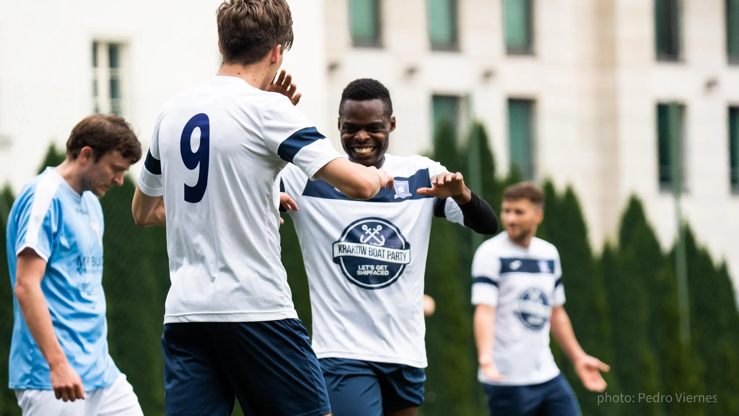 Adrian Paliś and Flavio Nkola of Krakow Dragoons FC celebrate a goal vs Bronowicki