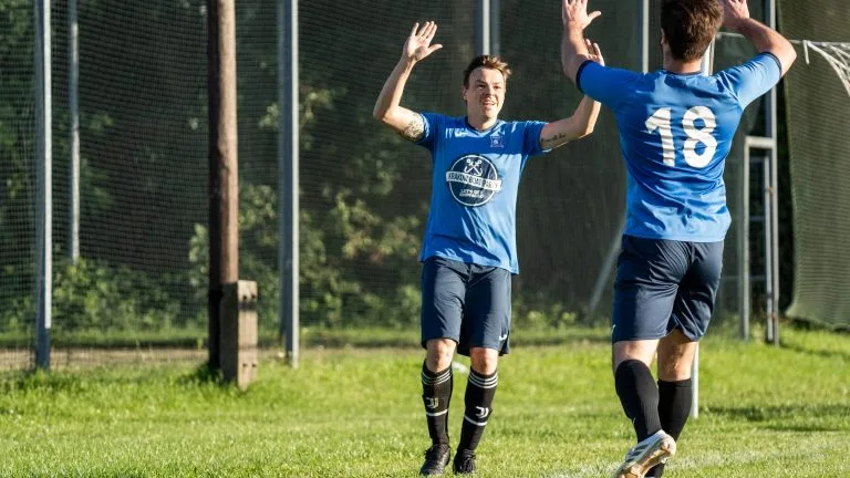 Enrico Forabosco and Joaquin Serrano of Krakow Dragoons FC celebrating a goal