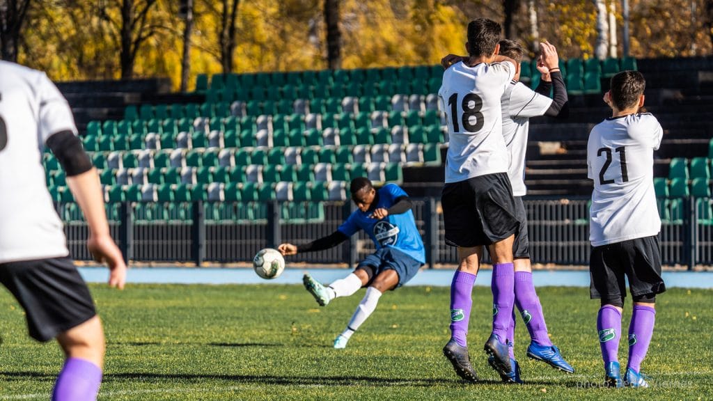 Flavio Nkola of Krakow Dragoons FC shooting a free kick vs Wawel