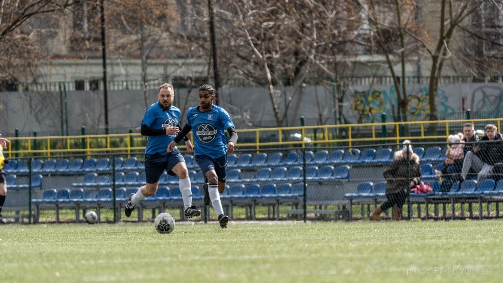 Rohit Chandran and Piotr Hajnrych of Krakow Dragoons FC vs Opatkowianka