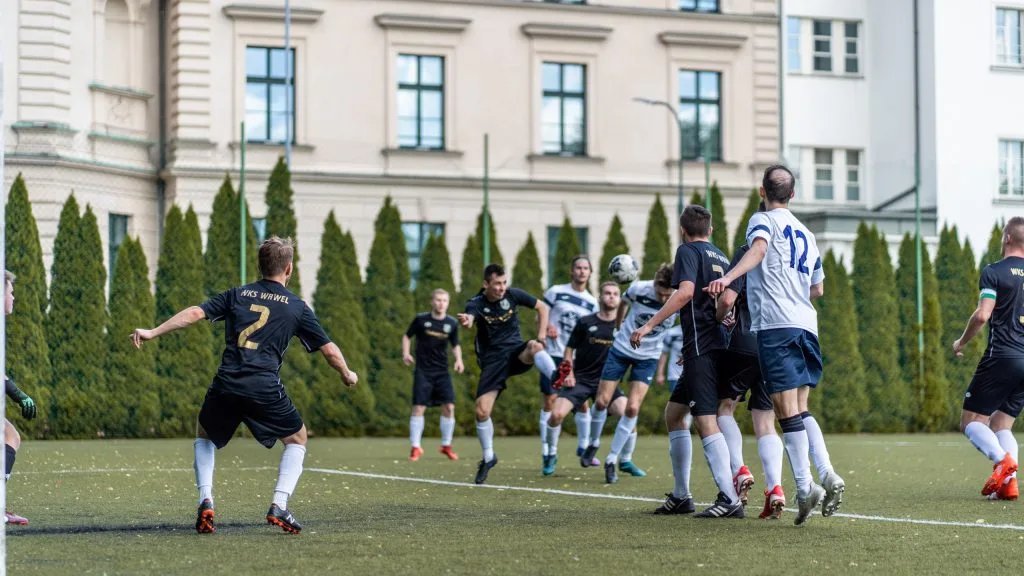 Adrian Paliś of Krakow Dragoons FC heads the ball into goal vs Wawel