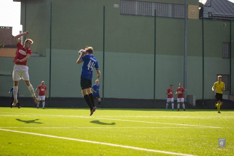 Bartek Chowaniec of Krakow Dragoons FC jumps inside the area unmarked and heads the ball into the back of the net vs Iskra Krzęcin