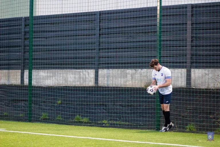 Michał Nowak prepares for a throw in during Krakow Dragoons FC vs Strzelcy