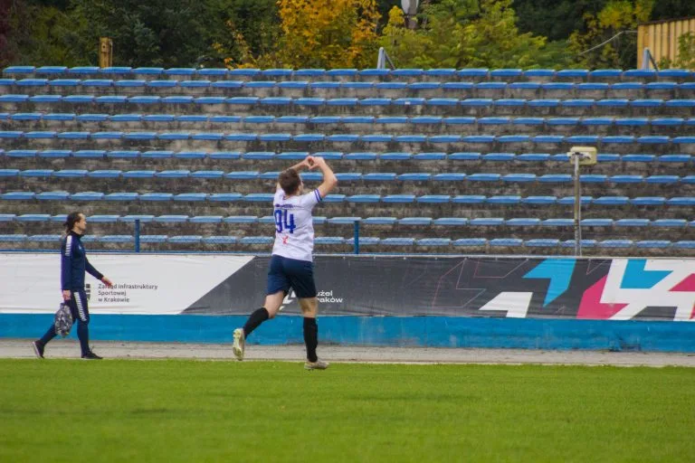 Błażej Święcicki of Krakow Dragoons FC celebrating a goal, motioning a heart to the fans