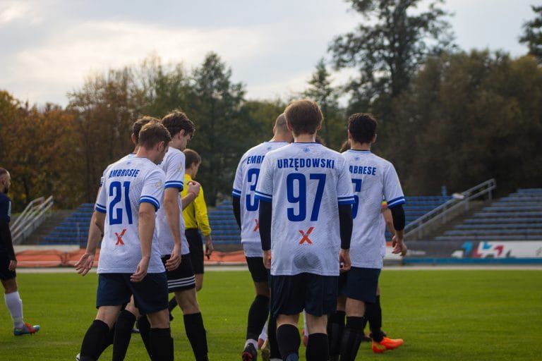 Players of Krakow Dragoons FC entering the field vs Wanda