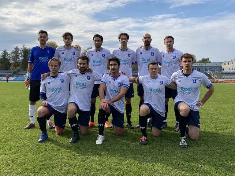 Krakow Dragoons FC starting 11 posing for a photo before the match vs Wanda