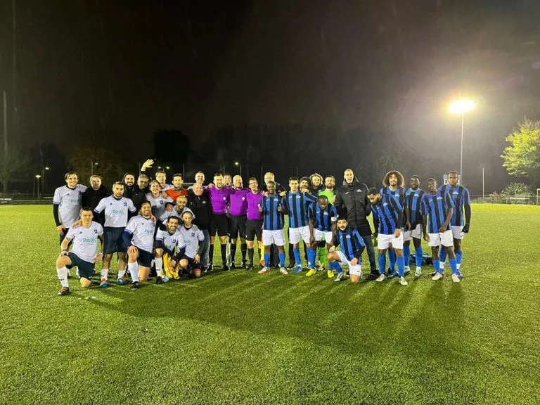 Krakow Dragoons FC and Afc DWS posing for a photo after their debut match in the Fenix Trophy