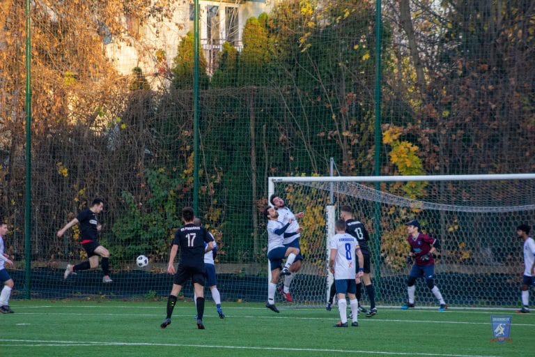 Podgórze player tapping the ball to the back of the net vs Krakow Dragoons FC