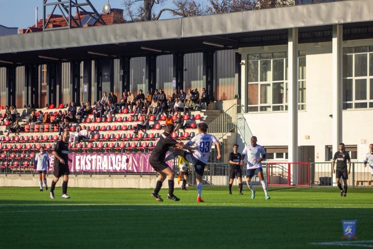 Krakow Dragoons FC vs Podgórze on a sunny day with a few dozen people on the stands