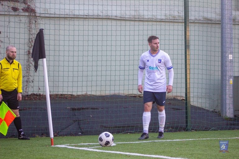 Robert Ambrosie of Krakow Dragoons FC preparing to take a corner kick