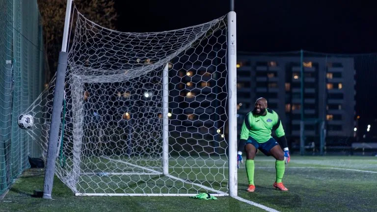 Afc DWS goalkeeper reacting in disbelief as a ball goes inside his goal vs Krakow Dragoons FC