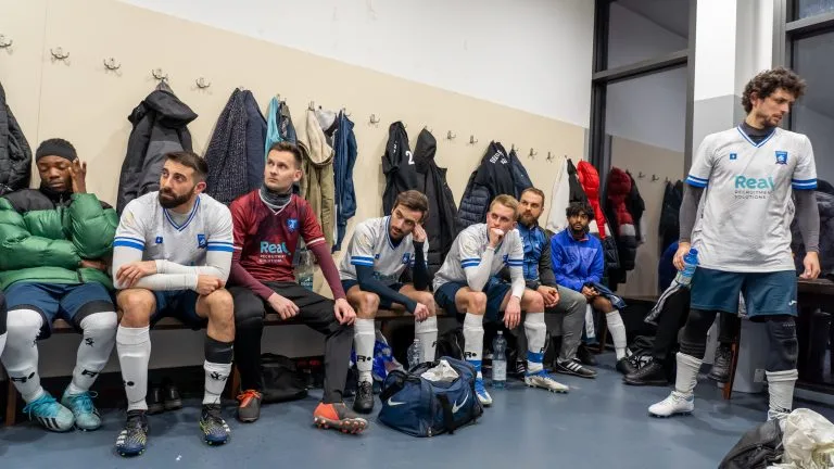 Krakow Dragoons FC in their dressing room at half-time