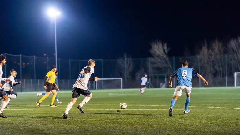 Jamie Beattie of Krakow Dragoons FC carries the ball forward