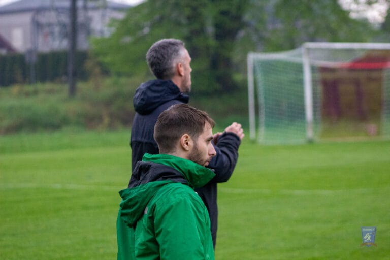 Edoardo Battaglion and Scott Halcrow of Krakow Dragoons FC giving instruction to players during a match