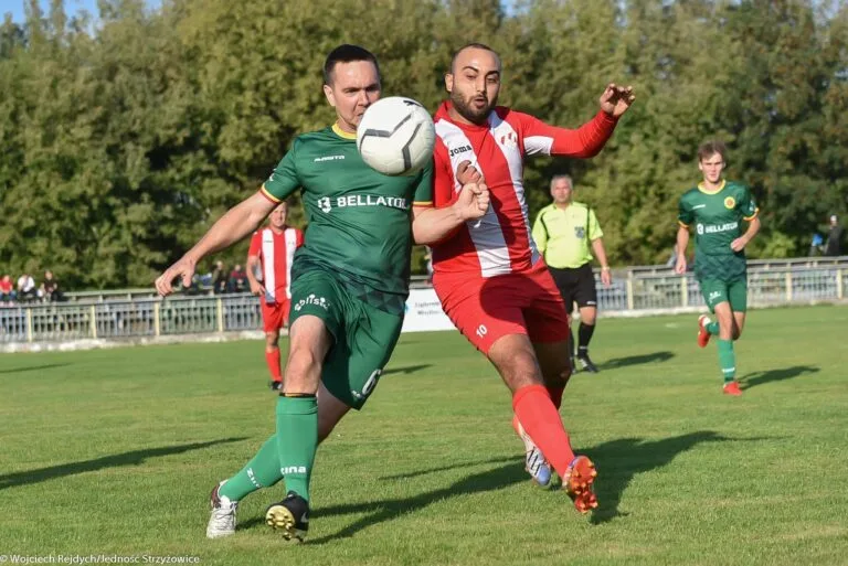 Ayoub Chardal of Krakow Dragoons FC disputing a ball with his previous team