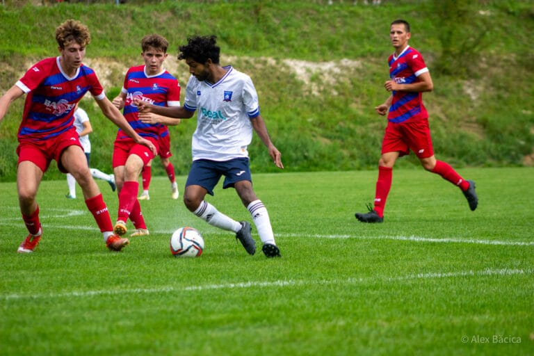 Rohit Chandran of Krakow Dragoons FC tries dribbling two opponents