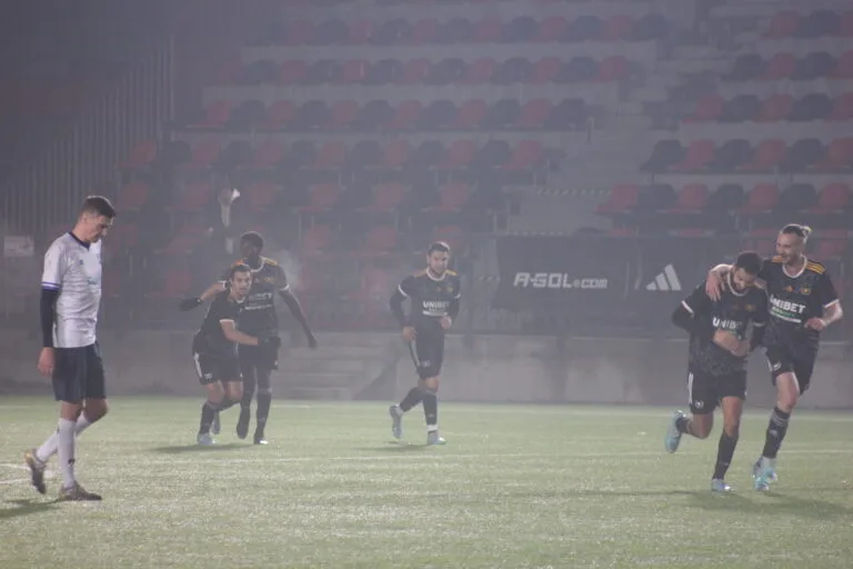 Players of Vinsky FC celebrating a goal vs Krakow Dragoons FC