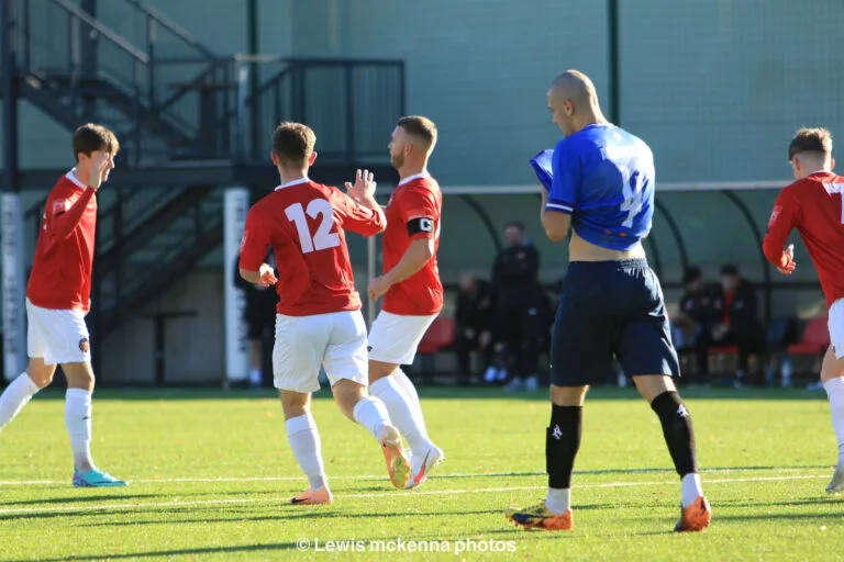 FC United of Manchester players celebrate a goal