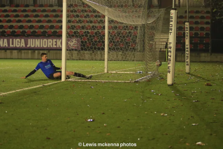 Brian Lemmen of Krakow Dragoons FC with a late slide unable to avoid a goal by the opponents