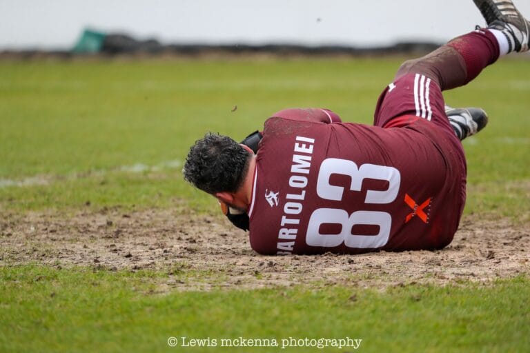 Goalkeeper Lorenzo Bartolomei of Krakow Dragoons FC dives to defend a shot