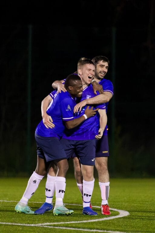 Krakow Dragoons FC players celebrate a goal