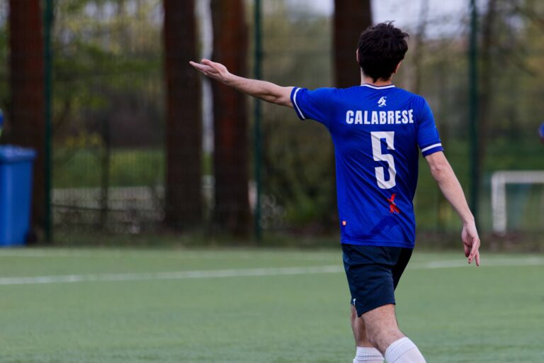 Simon Calabrese of Krakow Dragoons FC gesturing to the side