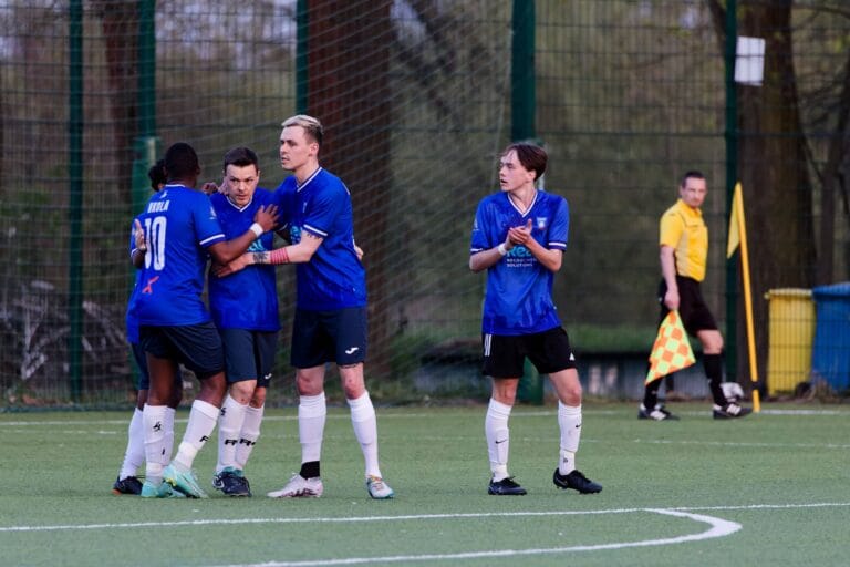 Krakow Dragoons FC players celebrate a penalty converted by Enrico Forabosco