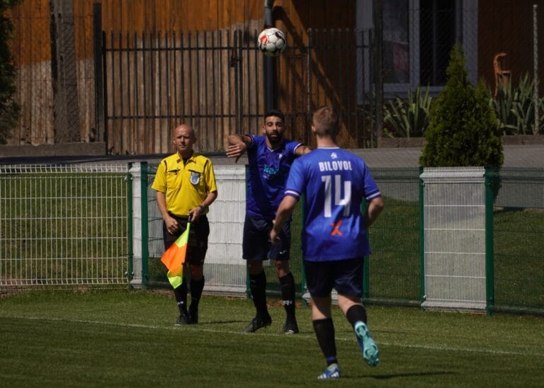 Francesco Leuci of Krakow Dragoons FC throwing the ball in the direction of teammate Roman Bilovol