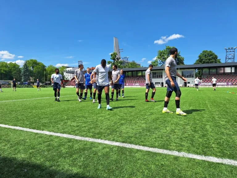 Krakow Dragoons FC players having a light-hearted chat during warm-up