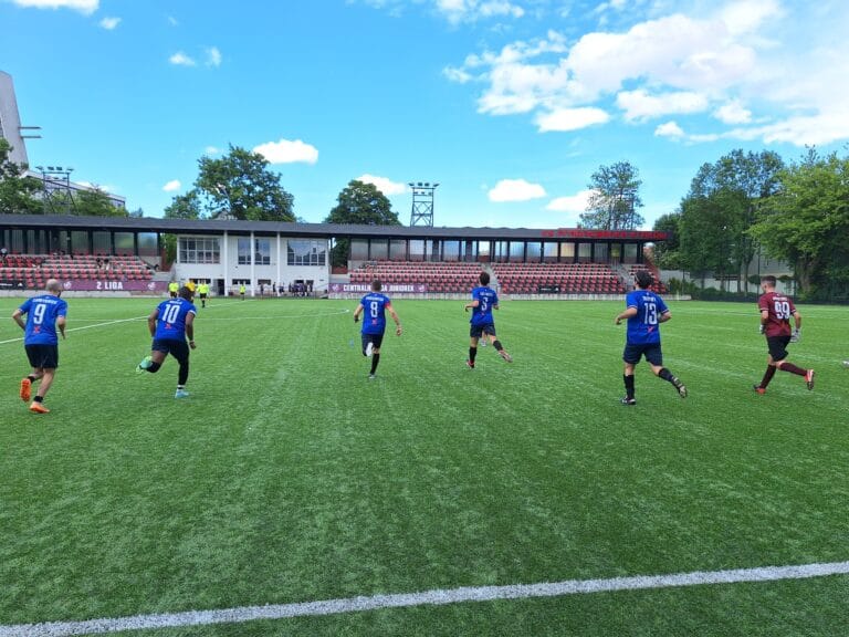 Krakow Dragoons FC players sprinting during warm-up