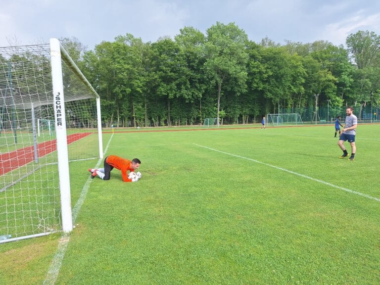 Marcin Obyrtacz of Krakow Dragoons FC warming up, assisted by teammate Michael Syska-Lamb