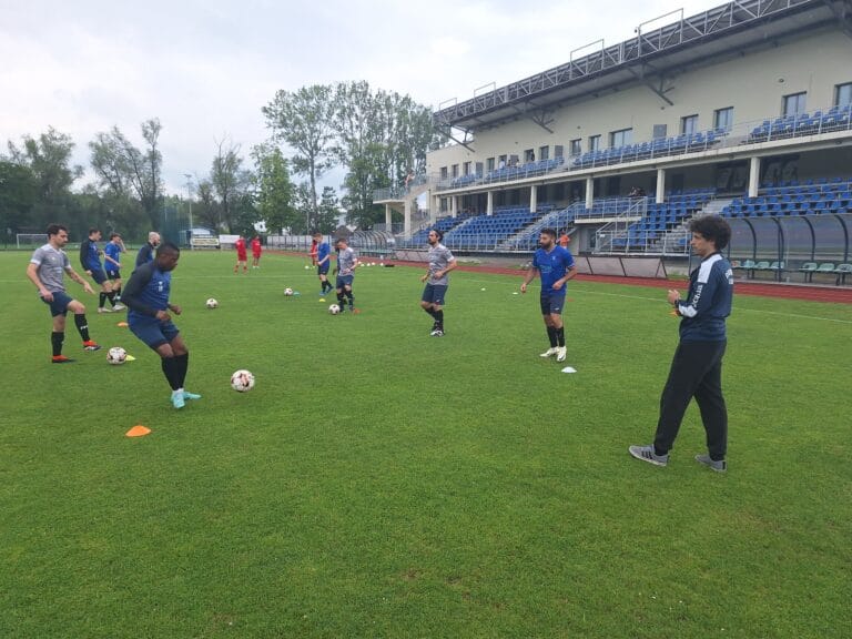 Krakow Dragoons FC players warming up with short passes