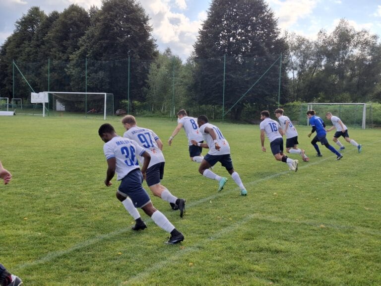 Krakow Dragoons FC players sprinting during warmup