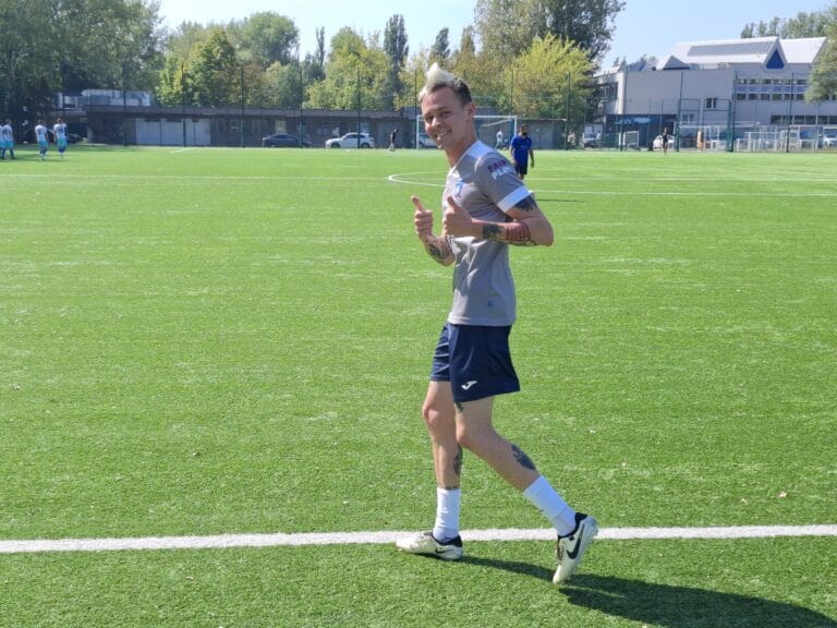 Vałdzis Fuhaš of Krakow Dragoons FC smiling and giving the thumbs up for the camera