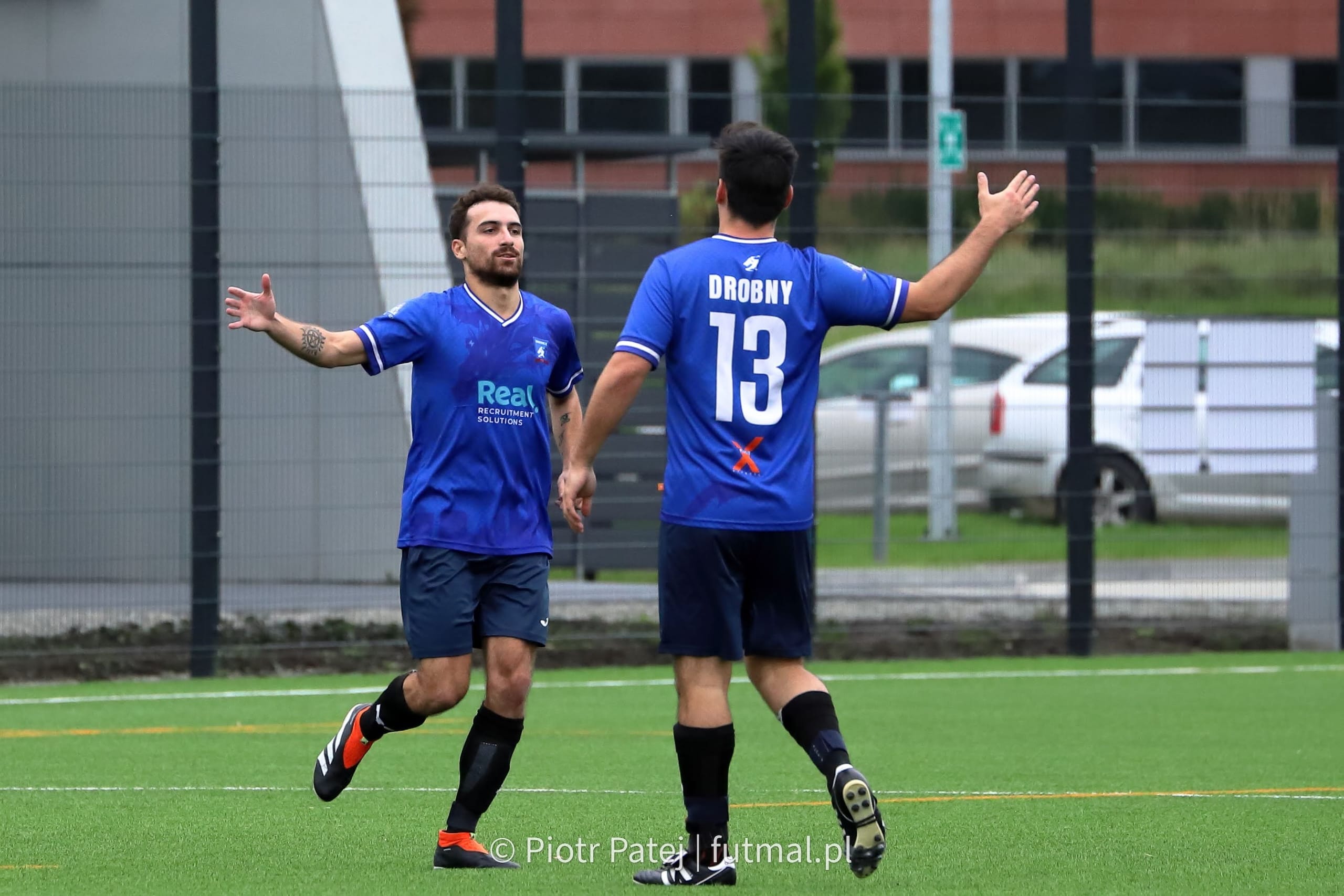 Simon Calabrese and Kuba Drobny of Krakow Dragoons FC celebrating a goal