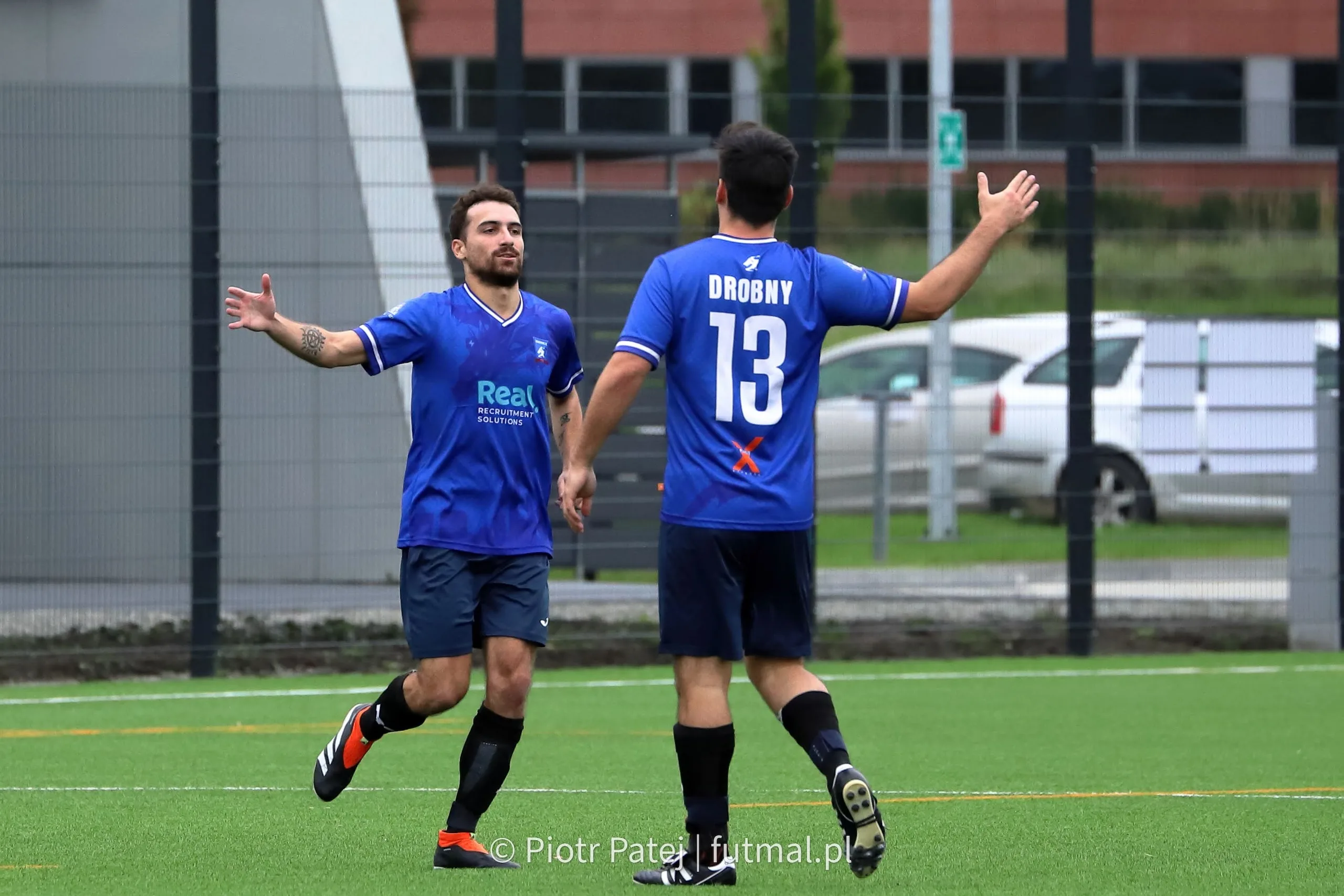 Simon Calabrese and Kuba Drobny of Krakow Dragoons FC celebrating a goal