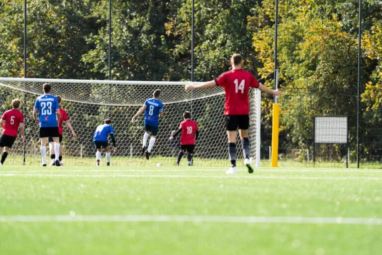 Sportowiec Modlniczka players celebrate as the ball enters the Krakow Dragoons FC goal