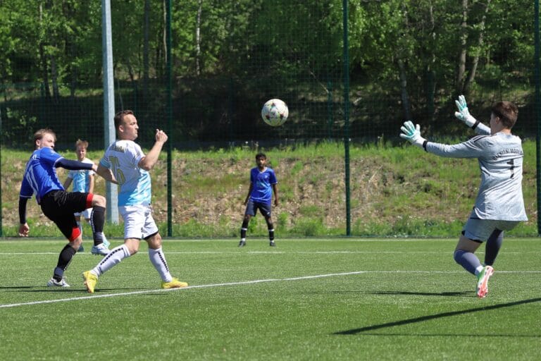 Szymon Urzędowski of Krakow Dragoons FC shoots the ball past the keeper into the back of the net
