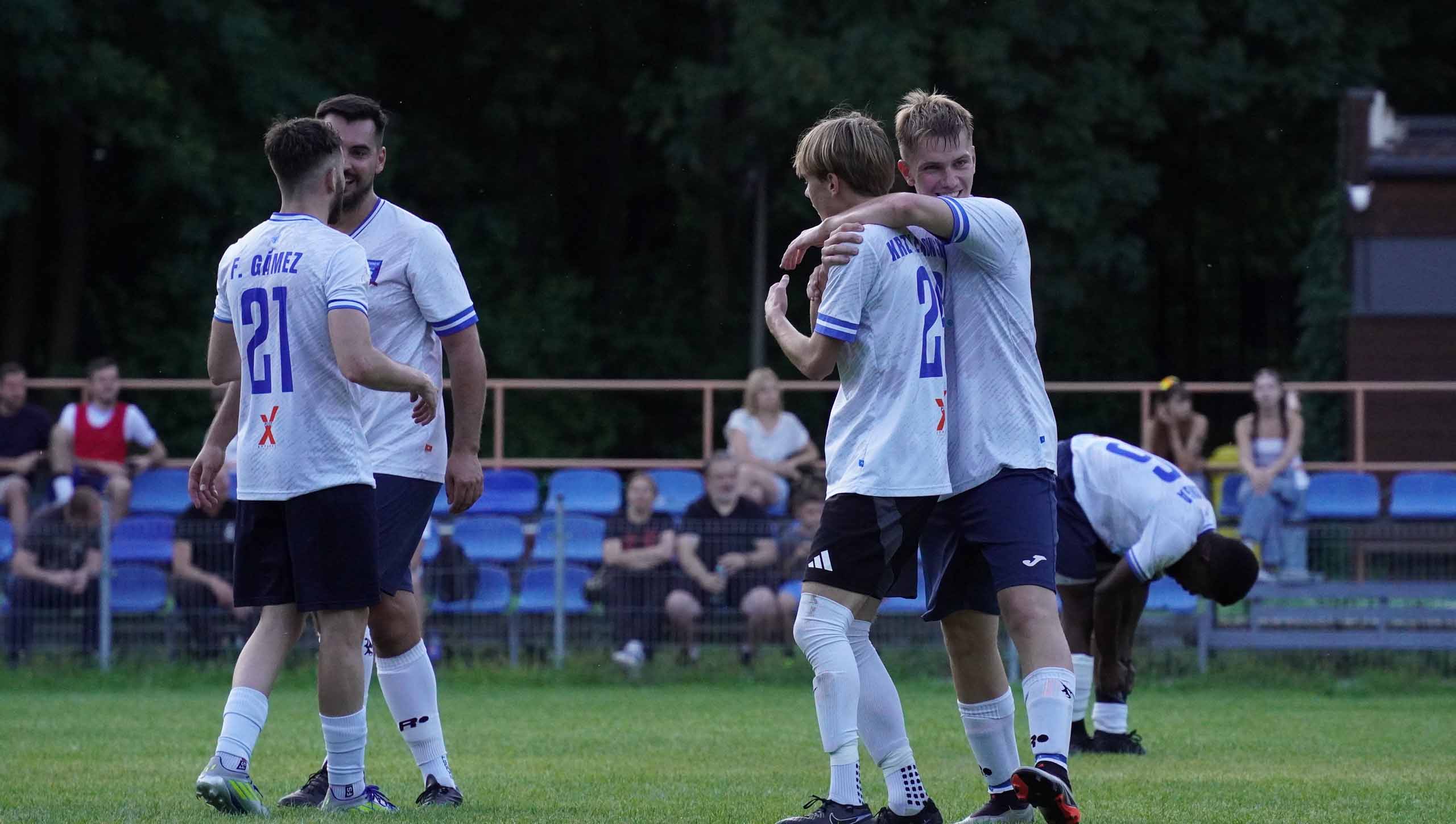Krakow Dragoons FC players celebrating a goal