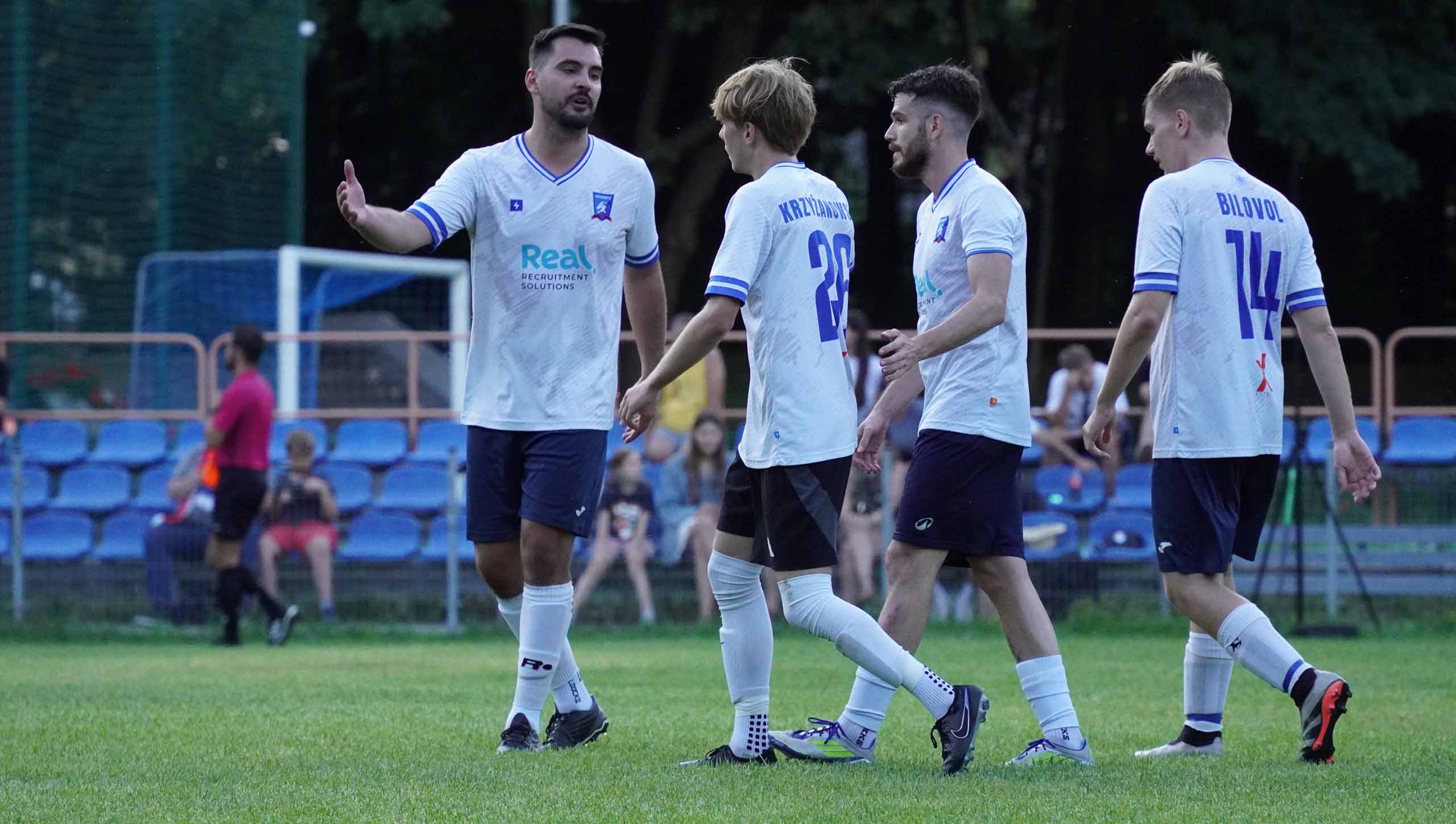 Krakow Dragoons FC greeting each other during a match