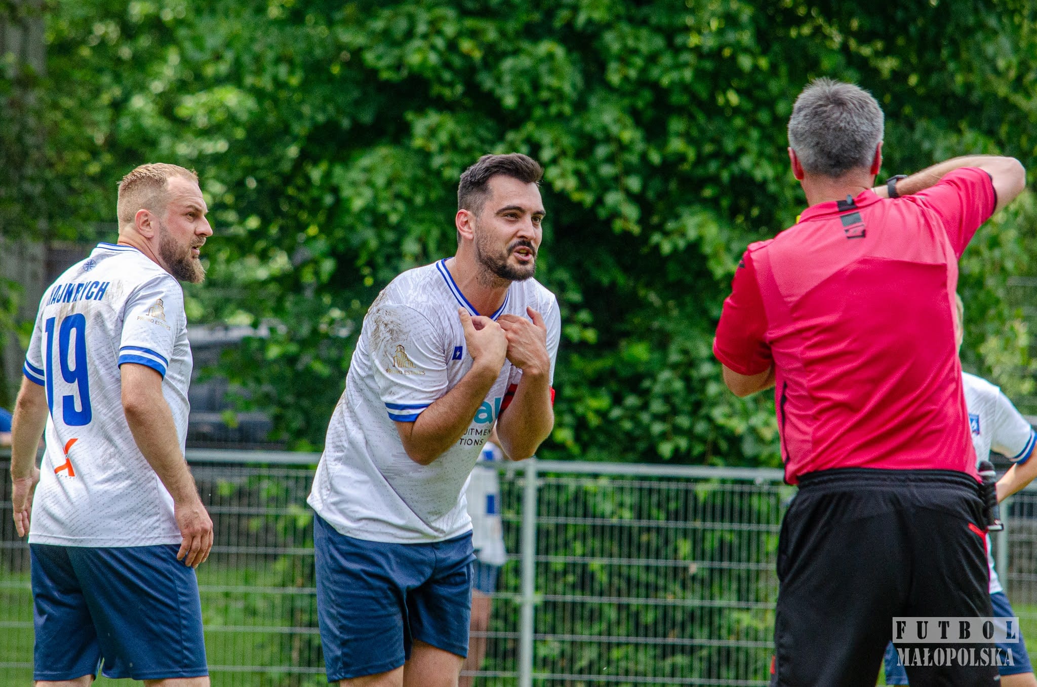 Kuba Drobny of Krakow Dragoons FC pleads with the referee after receiving a card