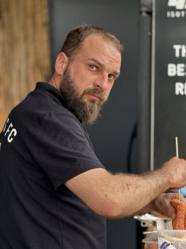 Piotr Hajnrych of Krakow Dragoons FC by the grill